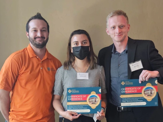 Ana Maria Corella and Max Rastch receiving certificates for Sotrmwater Outreach Program Community Project.