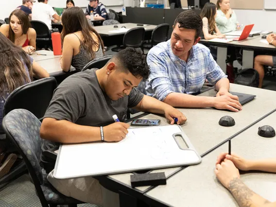 Student and instructor working together in a classroom setting