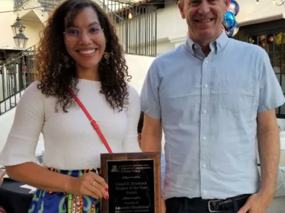 Amanda Bankston holding an award.