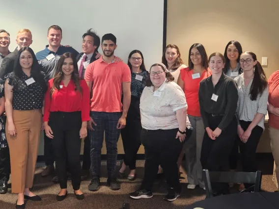 MPA students posing for photo during a capstone presentation.