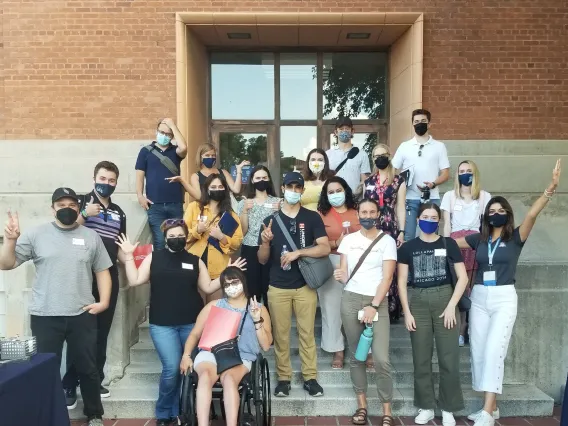 Group of students standing in front of the Social Sciences building.