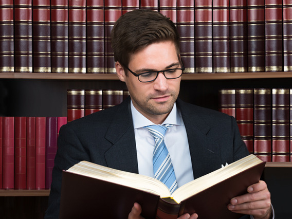 Advocate reading a book at court