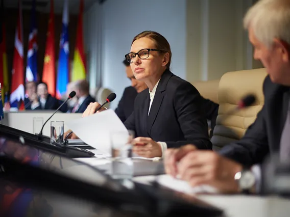 Woman at policy briefing