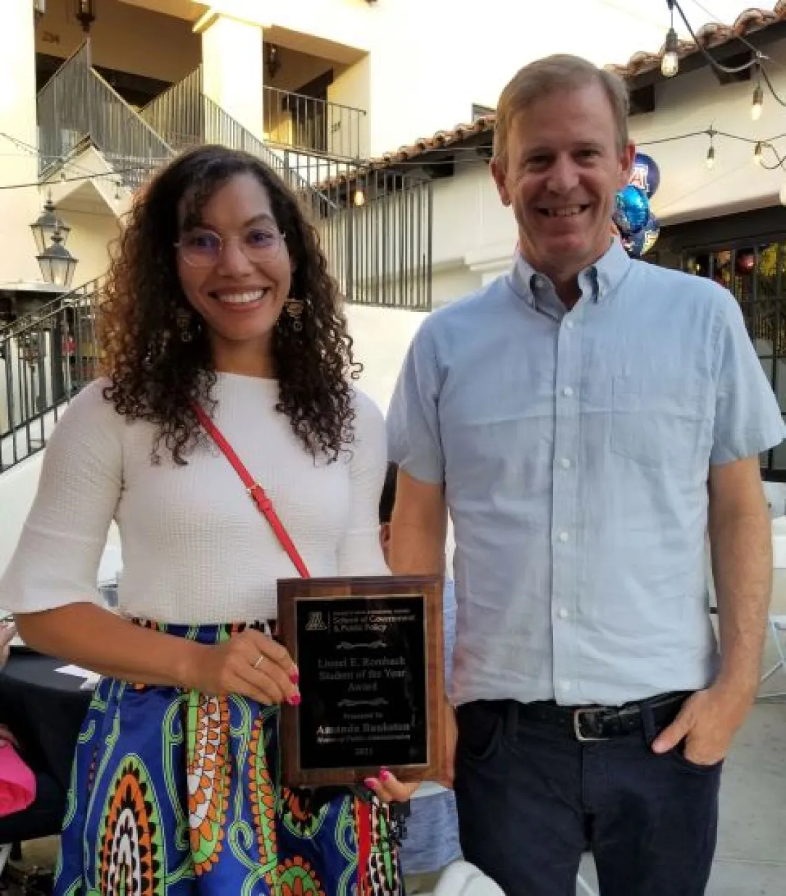 Amanda Bankston holding an award.