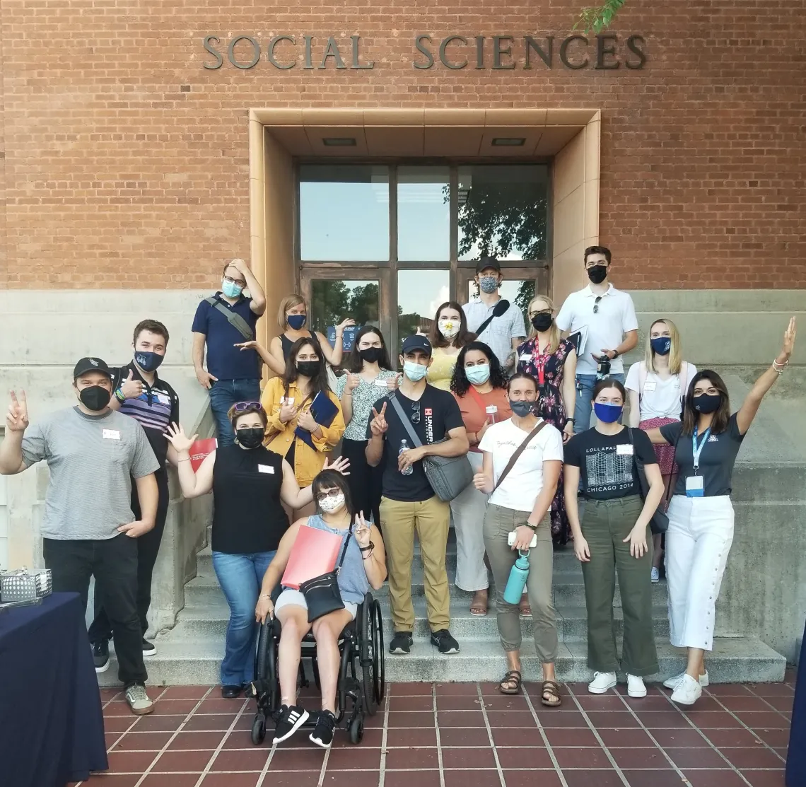 Group of students standing in front of the Social Sciences building.