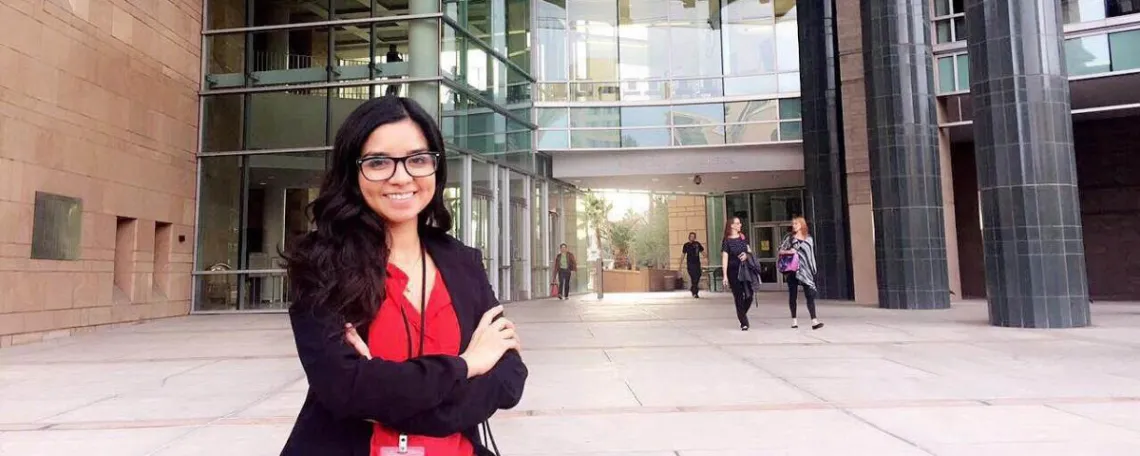 Studet intern in front of government building