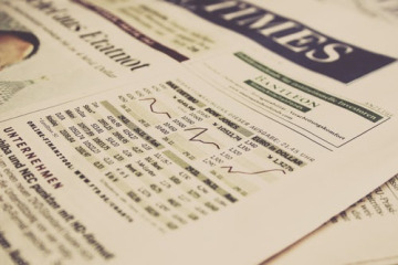 Close up of a financial report in the newspaper