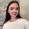 Charlotte McTaggart smiling in front of map